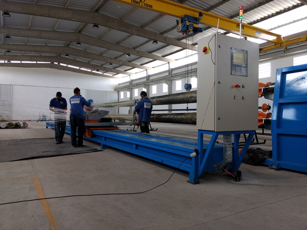 Filament winding machine for composite poles in operation
